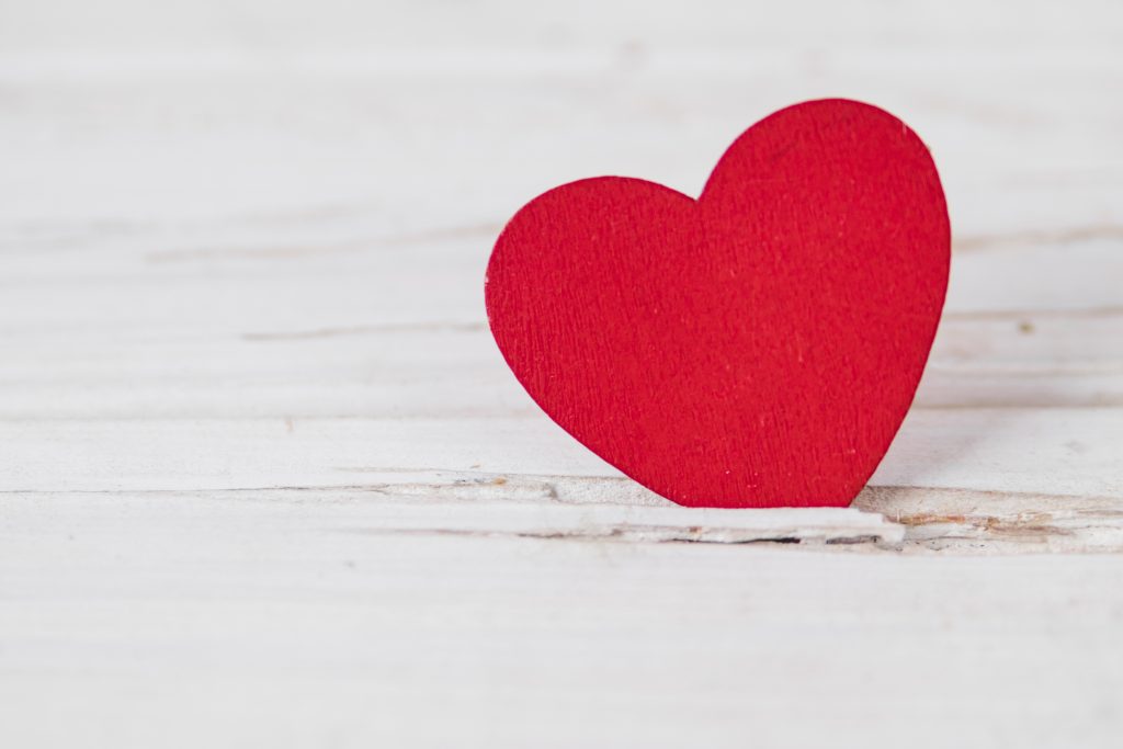 close up heart wooden tabletop close up heart wooden tabletop